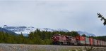 CP 8916/8742 W/B through Banff, the Rocky Mountains in the background.